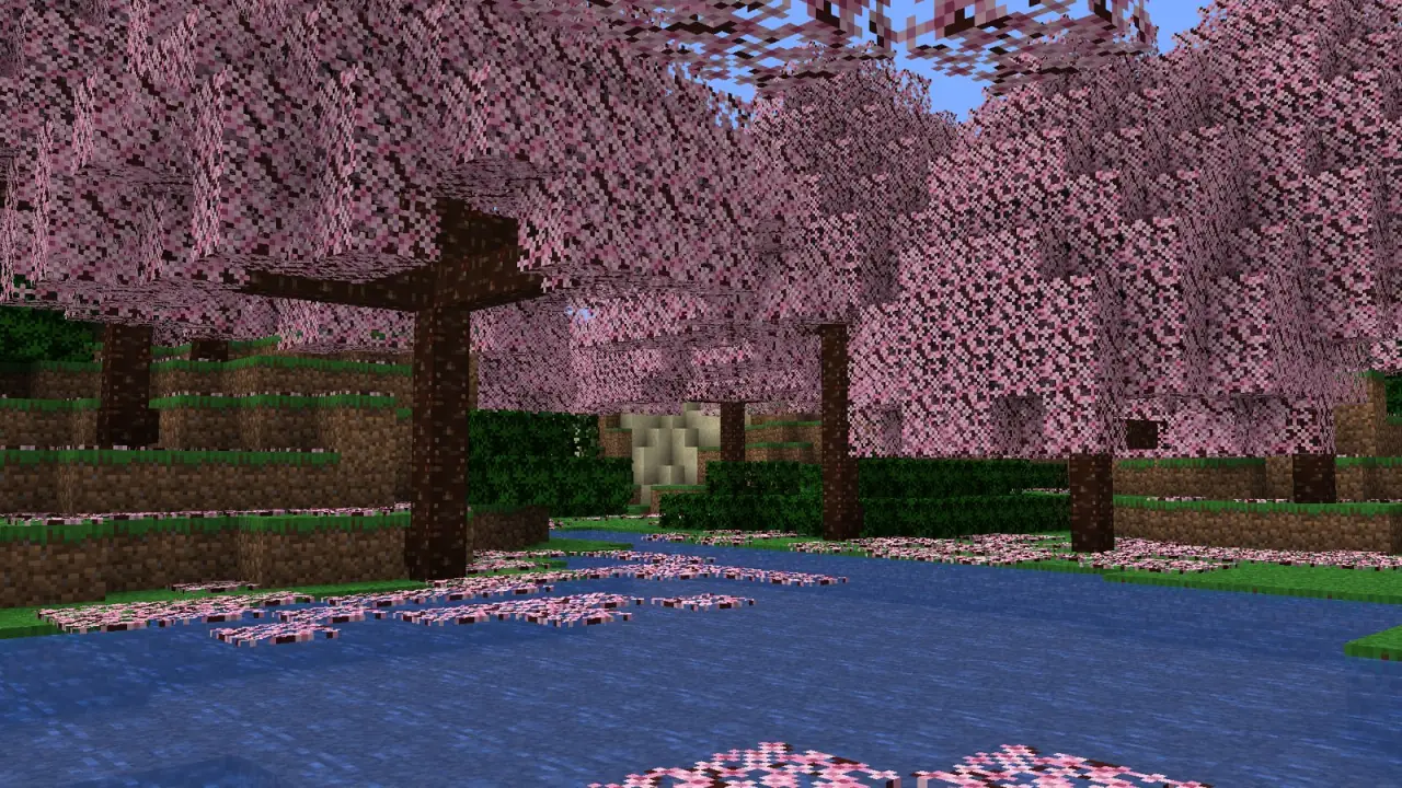 A sakura forest of pink trees beside a lake