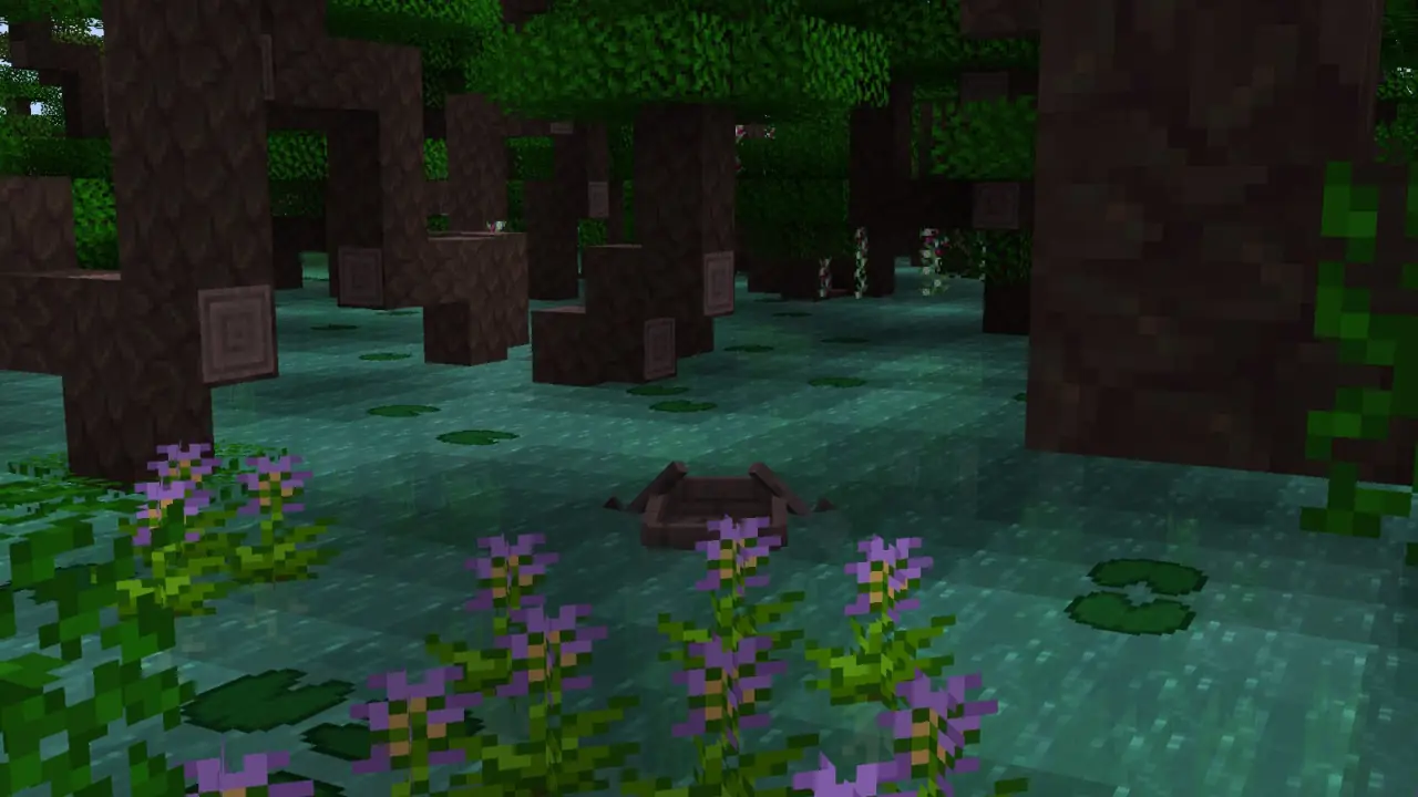 A dark swamp with lily pads and purple flowers