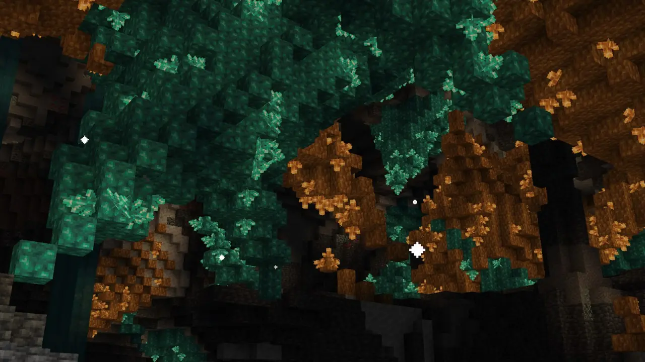 Teal and amber growth in a lichen cave