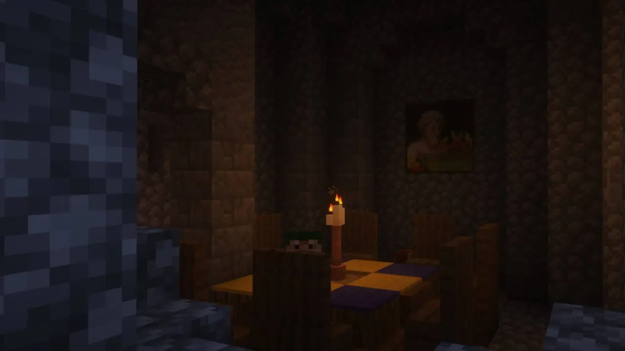 A candlelit table in a dark stone room